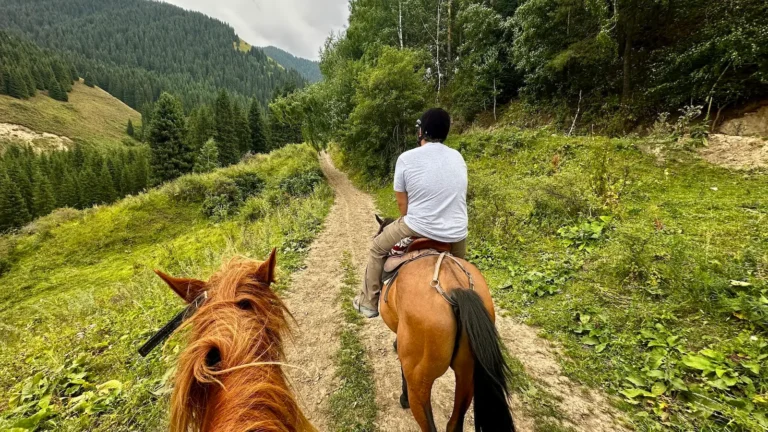 Riding horses through Chon Kemin valley