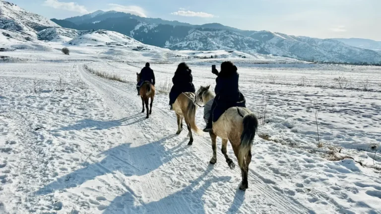 Horse riding in winter Chon Kemin valley in Kyrgyzstan